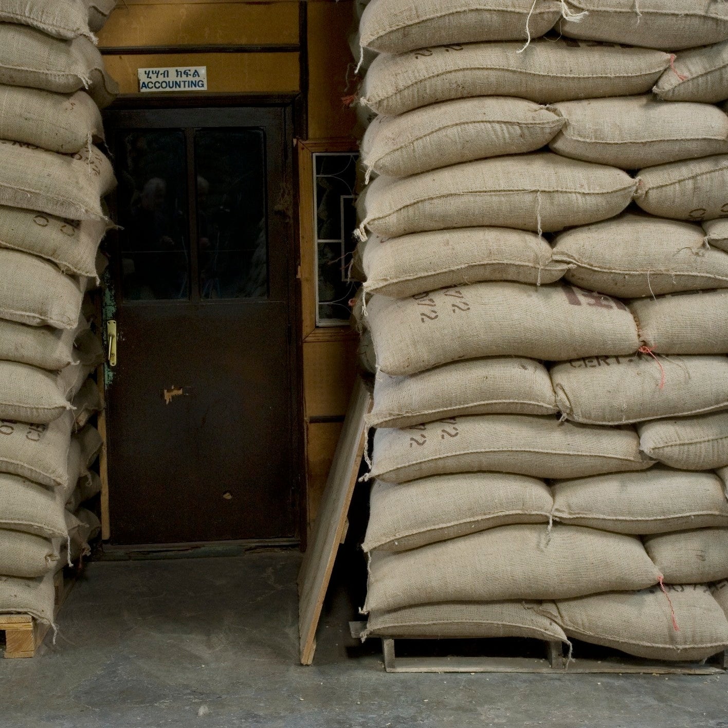 Stacks of sandbags in a warehouse setting