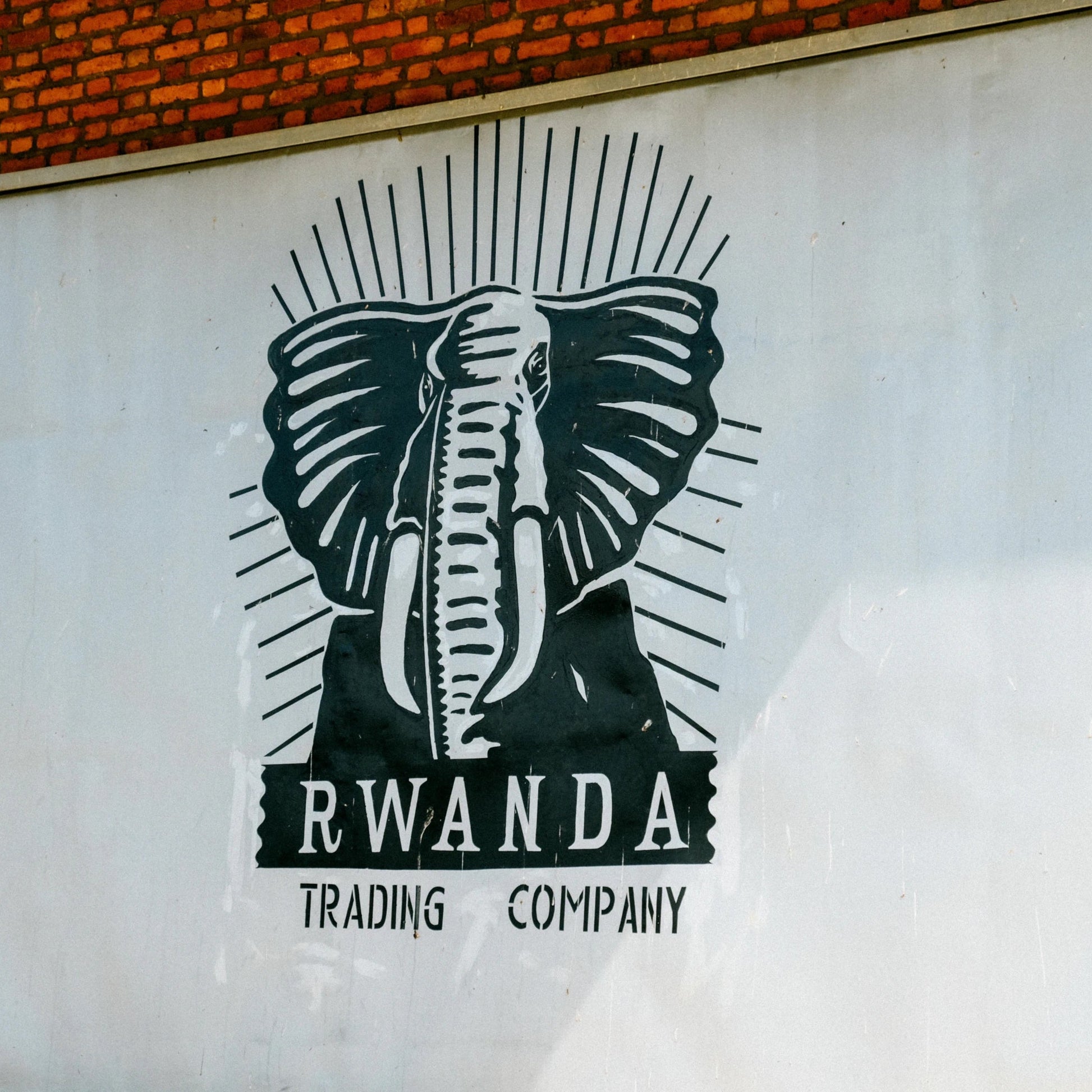 Logo of Rwanda Trading Company with an elephant design on a white background.