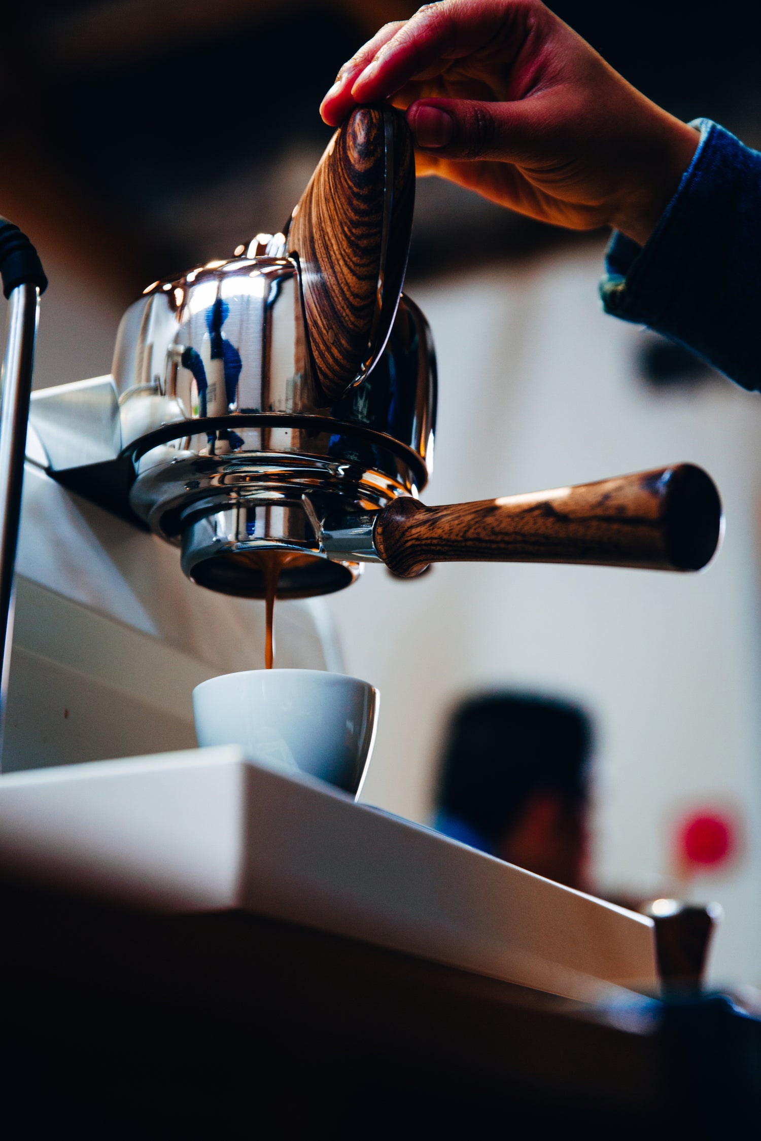 espresso machine with coffee dripping into a cup
