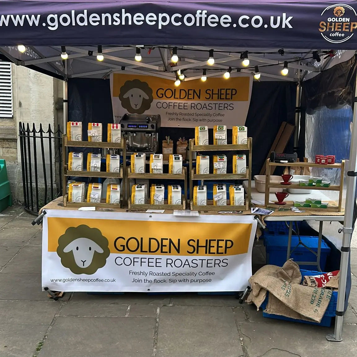 Shambles market Stroud, Golden Sheep Coffee stand with bags of coffee